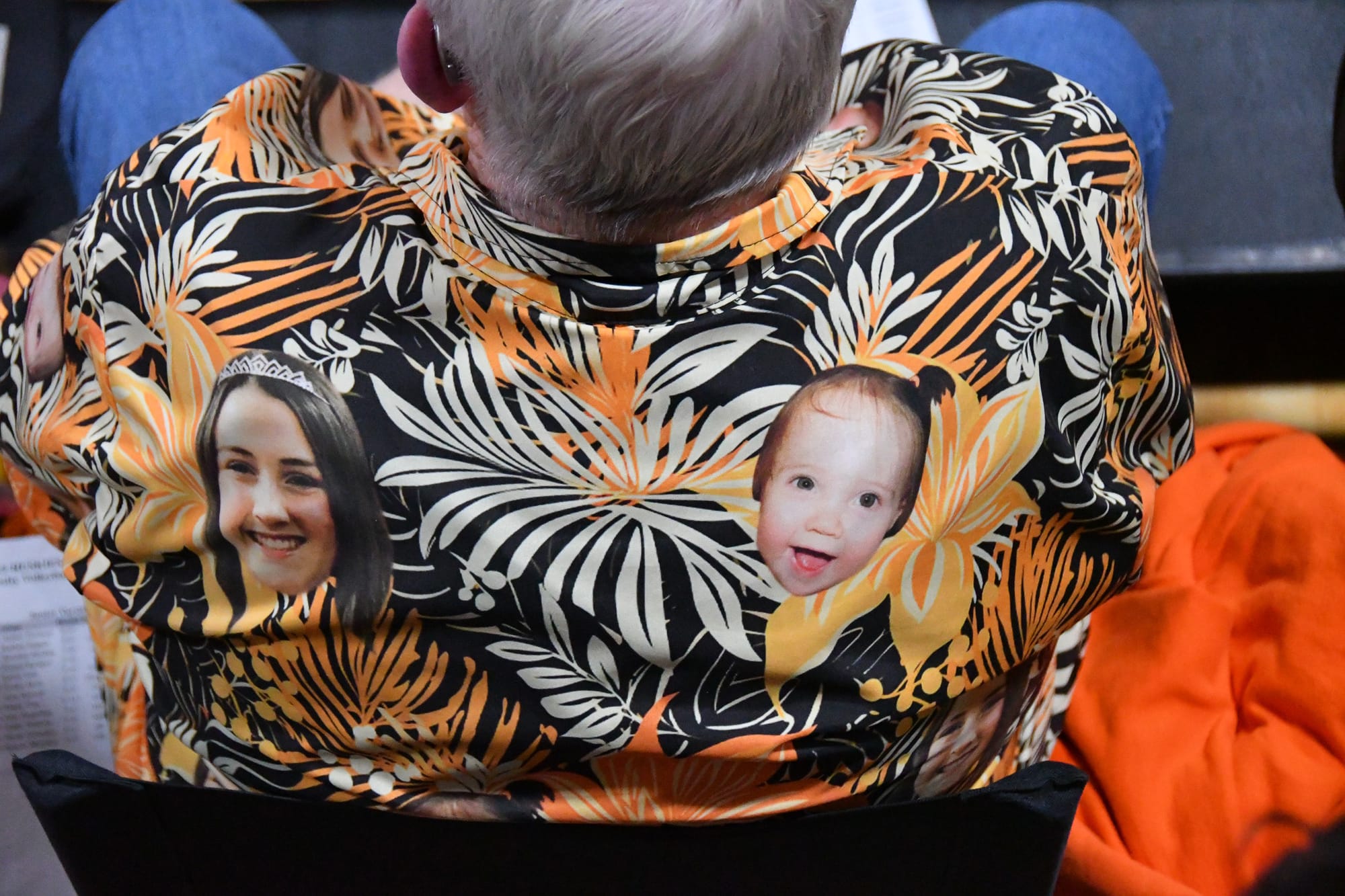 In true senior-night fashion, Tiger parents donned Hawaiian shirts featuring baby and current photos of their graduating players.