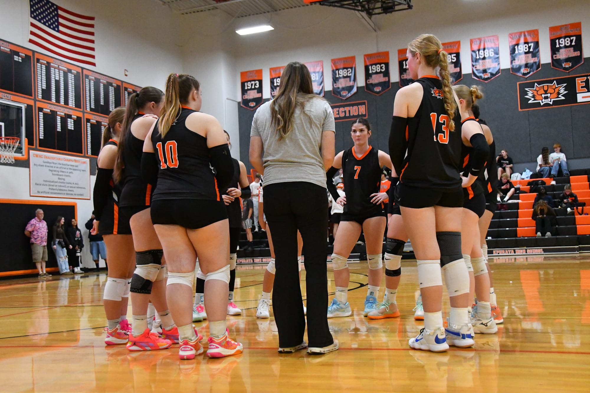 Ephrata head coach Britney MacLeod gathers her team during a timeout to reset momentum.