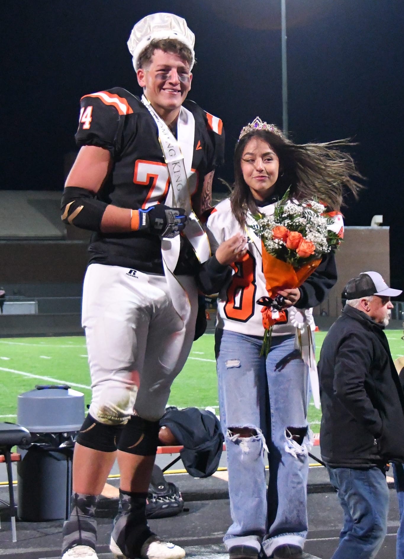 Tiger offensive lineman and defensive end Michael Park (74) and Natalin Abundiz were crowned Homecoming King and Queen during the halftime ceremony.