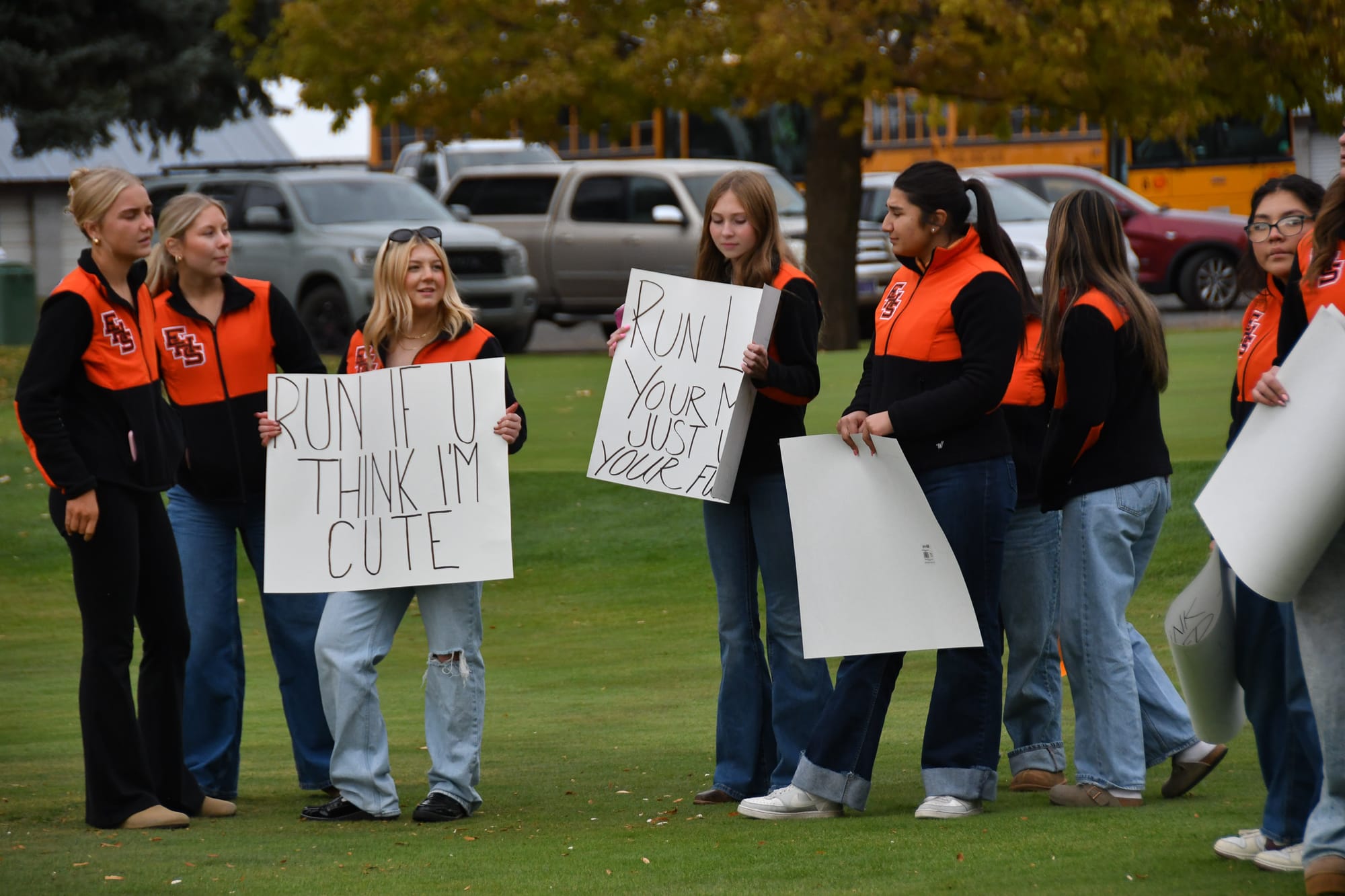 Ephrata cheerleaders line the course at Lakeview Golf and Country Club, waving signs and cheering on Tiger runners during last week’s CWAC league meet.