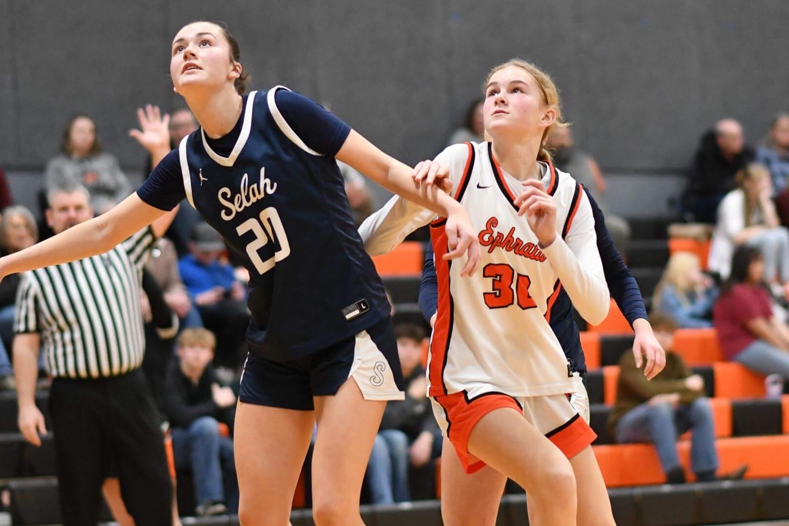 Ephrata's Brooklynne Addink (30) fights for position under the basket against Selah. The freshman pulled down 12 boards in three games last week.
