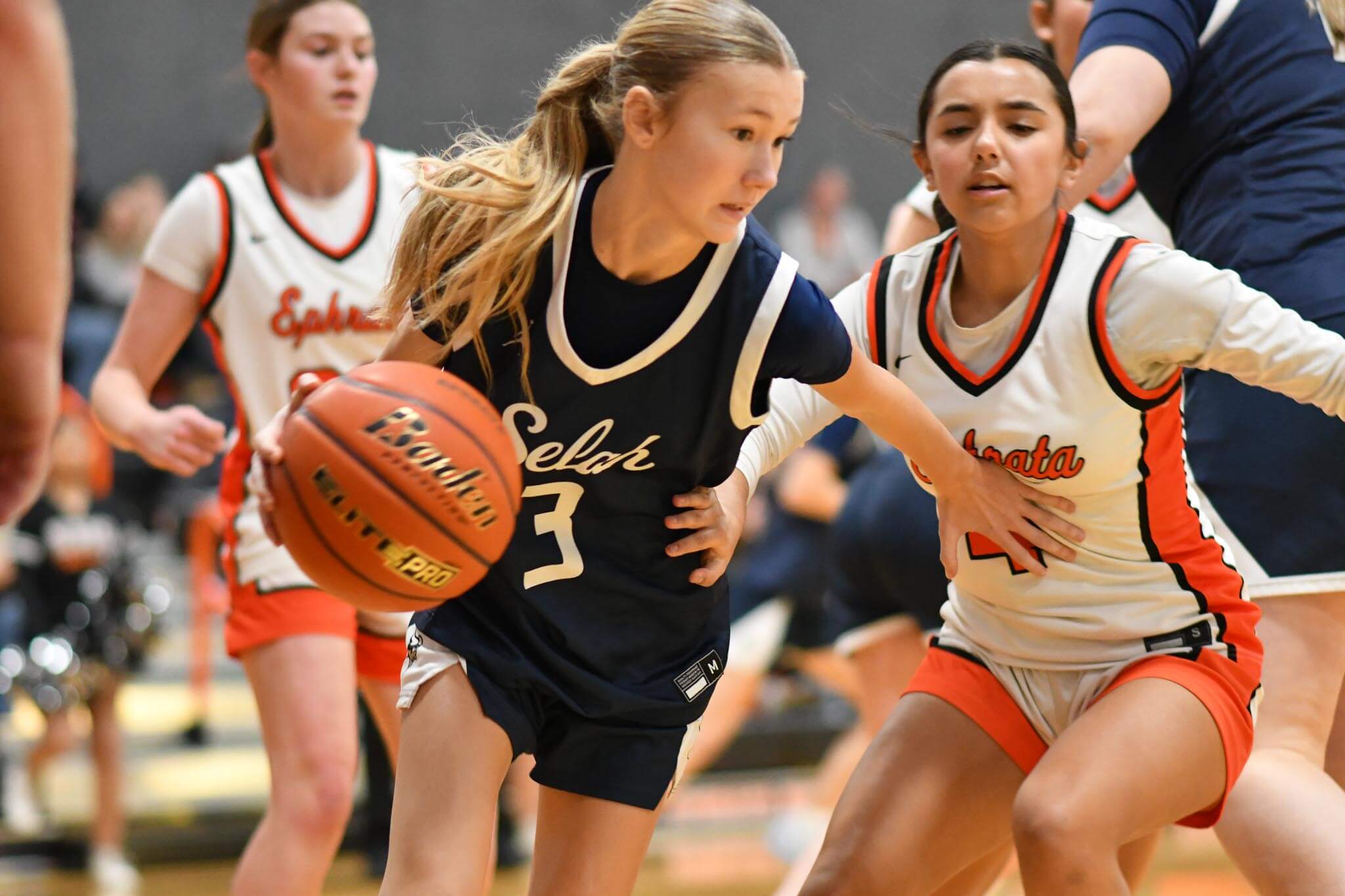 Alexis St. Mary (4) locks in on Selah's Harper Tilley (3) during Saturday's game at Marty O'Brien Court. St. Mary scored four points on 2-of-2 shooting in Tuesday's loss to Othello.