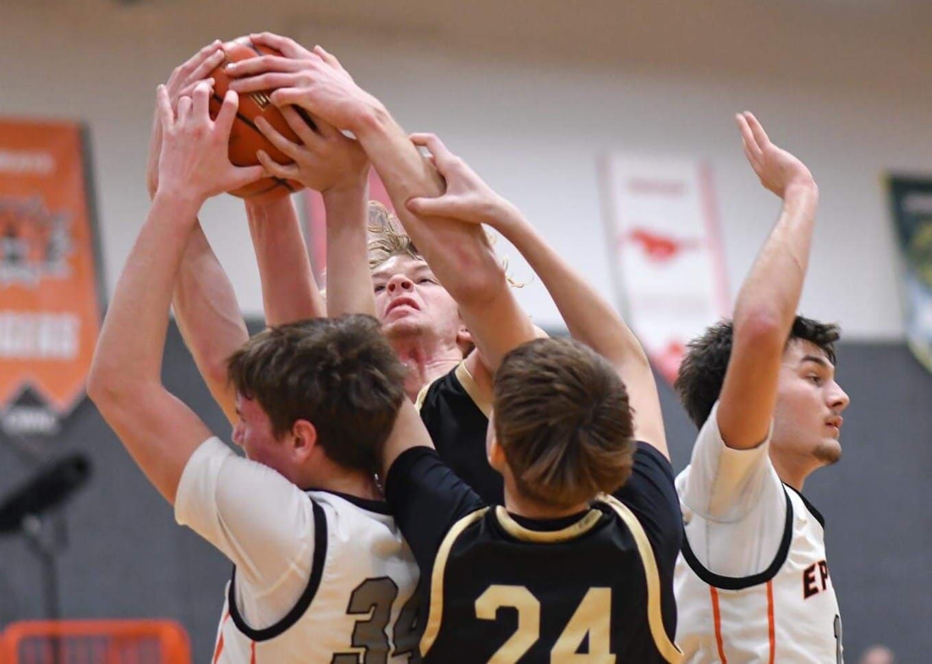 Benson Bair scraps for a rebound in a sea of Selah arms. Bair paced the Tigers with 26 points and 12 boards across three games.