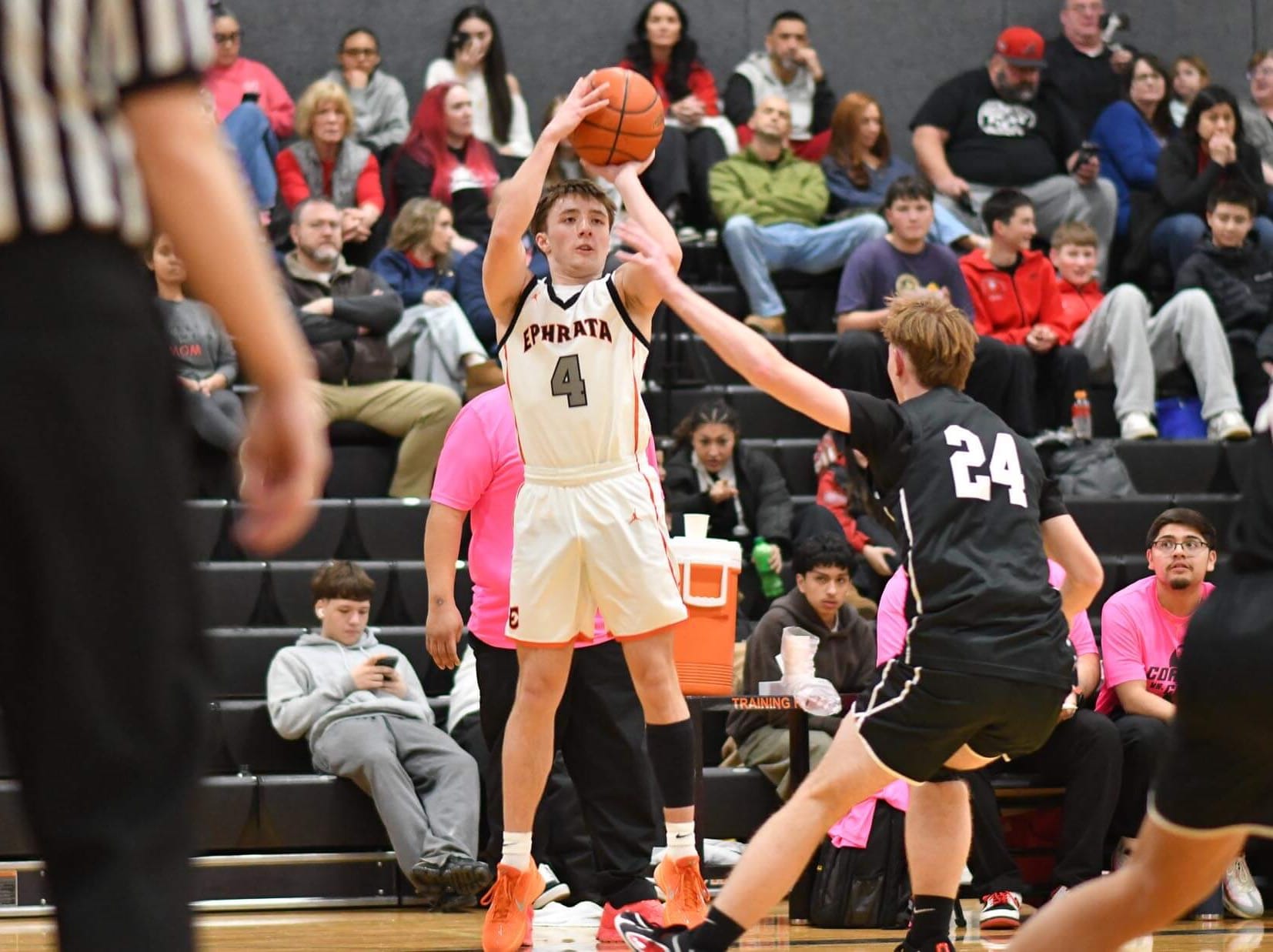 Ephrata's Wyatt Schluckebier (4) lets it fly from beyond the arc in the second quarter Tuesday. Schluckebier caught fire with three straight threes to help the Tigers take a 36-34 halftime lead.