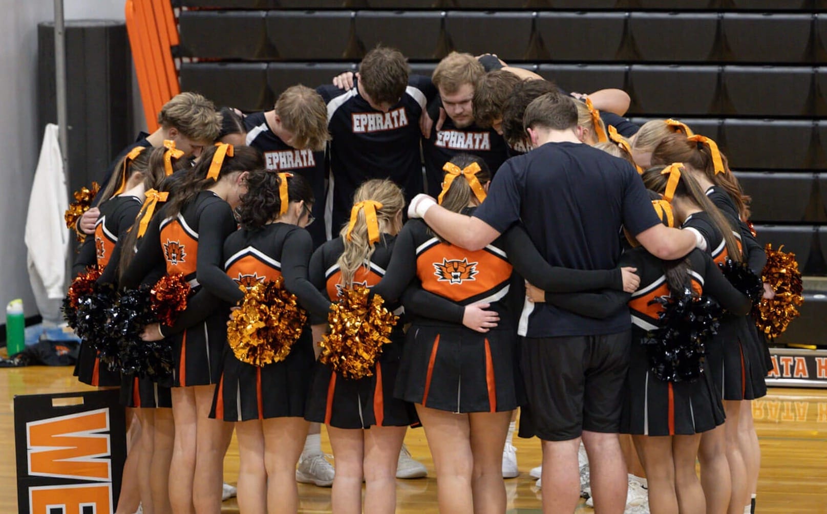 The Ephrata cheer and stunt team huddles before taking the mat. Photos by Brooke Kleyn