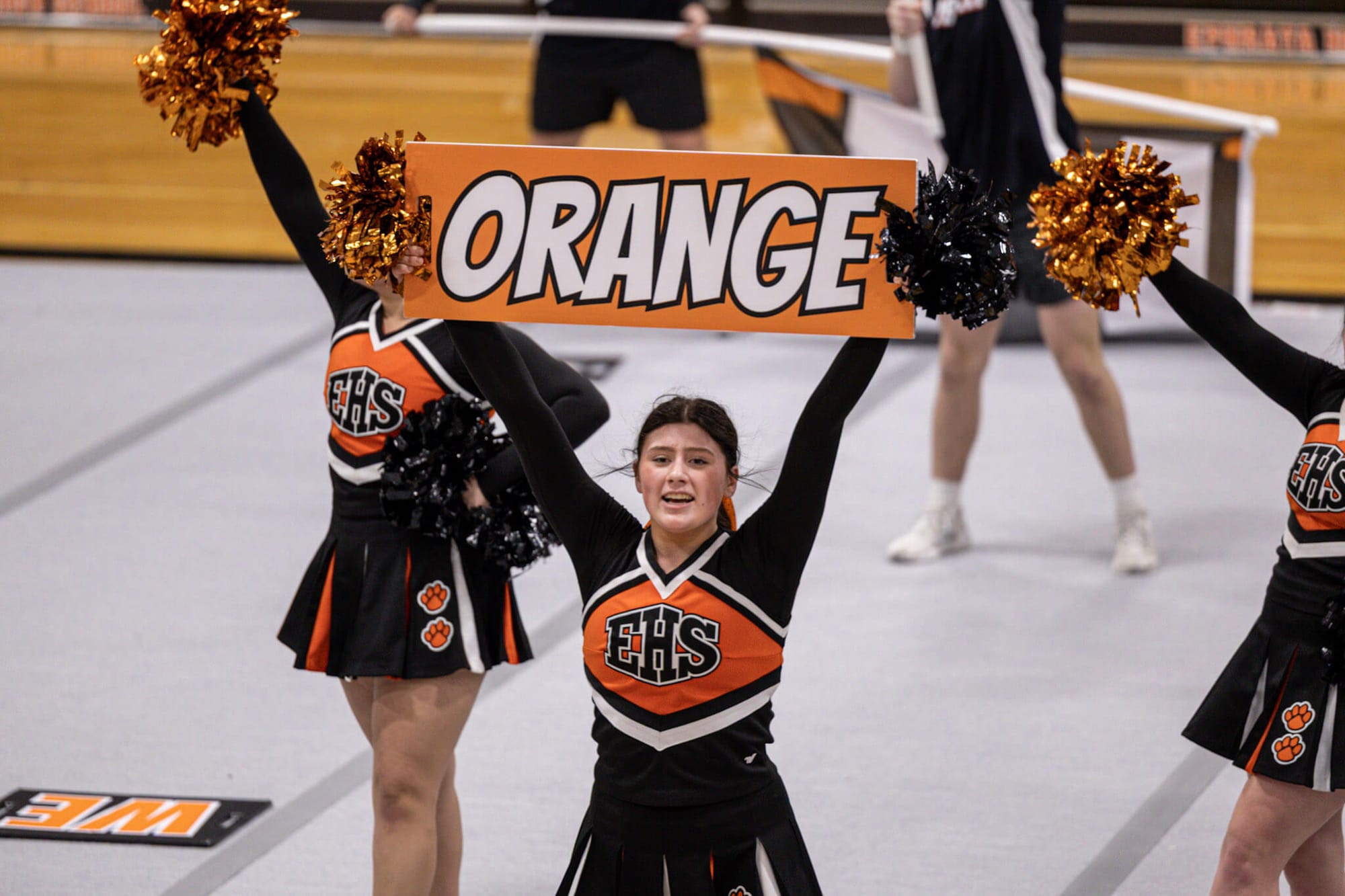 Ephrata's Scarlett Uribe holds up a sign during the Game Day routine at the team's performance showcase.