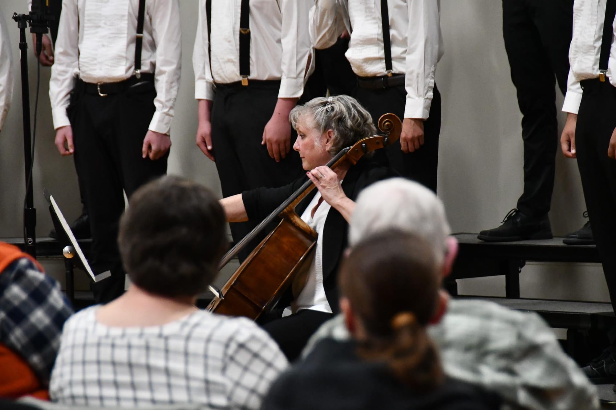 Kathryn Arriola accompanies the EHS Bass Clef Choir on cello during 'Black is the Color of My True Love's Hair.'